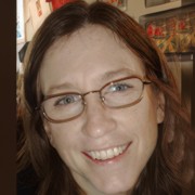 Susan Dubois Smiling woman with long dark hair and glasses